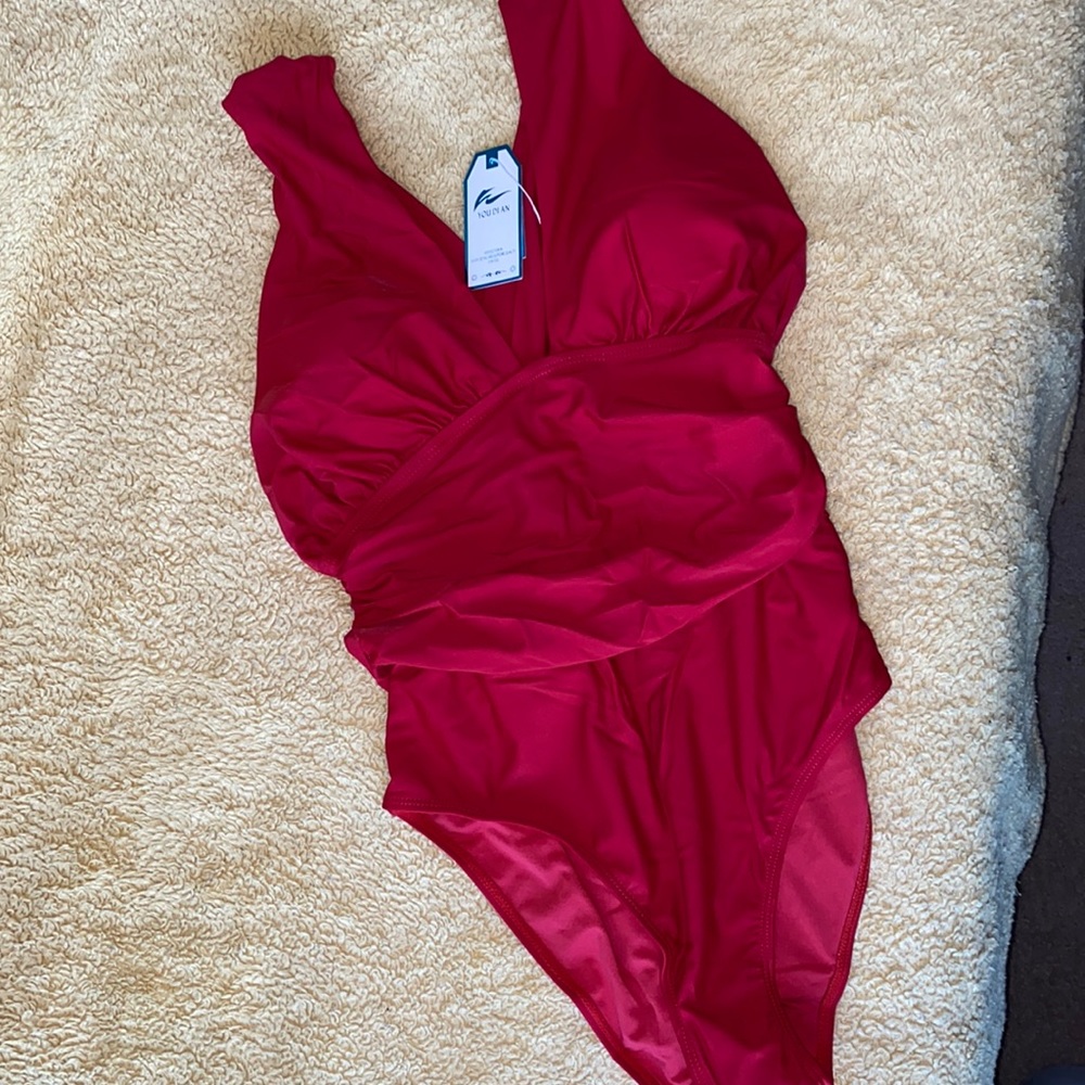 One piece Red swimsuit,  size XL.  Crisscross back straps gathered siding.